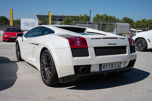 Montmelo, Spain – October 20, 2023: Rear view of pearl white Lamborghini Gallardo Italian supercar