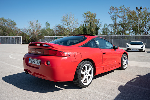 Montmelo, Spain – October 20, 2023: Rear view of a nice red second generation Mitsubishi Eclipse