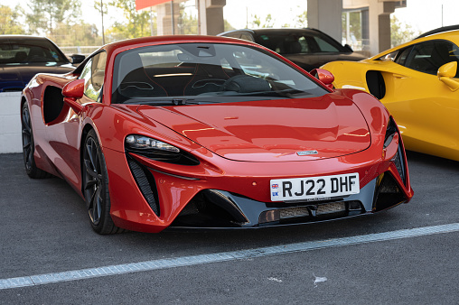 Montmelo, Spain – October 20, 2023: Front view of a modern red McLaren Aretura supercar