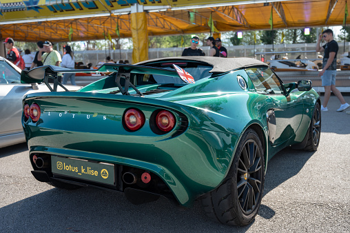 Montmelo, Spain – October 20, 2023: Rear view of a light English sports car, the green Lotus Elise