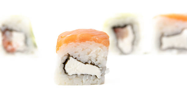 istock Sushi with fish and cucumber isolated on white background. Close-up 2002843957