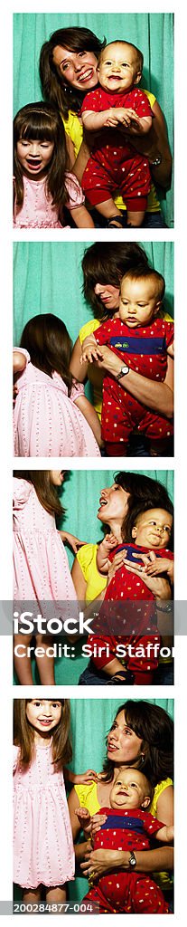 Mother with children (1-3) in photo booth  Photo Booth Stock Photo