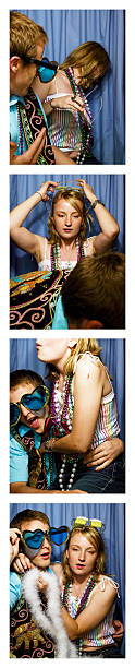 Young couple playing around in photo booth  same person multiple images stock pictures, royalty-free photos & images