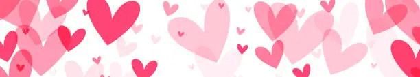 Vector illustration of panoramic array of hearts in shades of pink on a white background