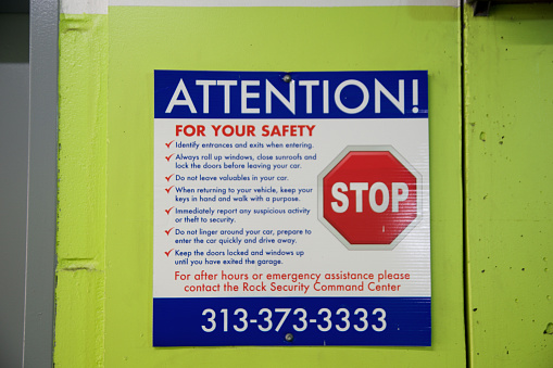 Detroit, Michigan, United States - May 22, 2018: Warning sign in a public car park.