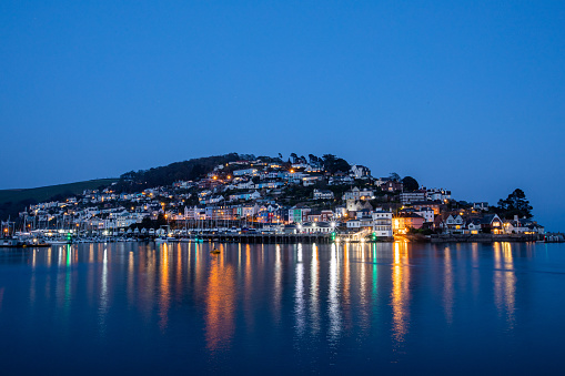 Houses on the hillside at Kingswear in twighlight on the banks of The River Dart, Dartmouth, Devon