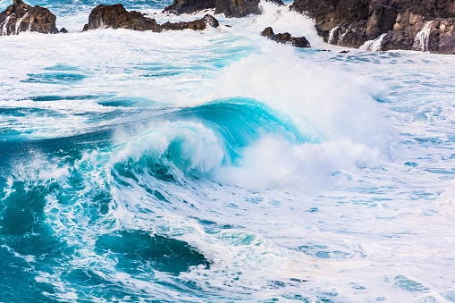 Aerial drone footage from the coast of the Pacific Northwest, featuring Oregons beautiful rugged terrain and blue ocean waves.  Captured in Depoe Bay, Oregon state,  USA.