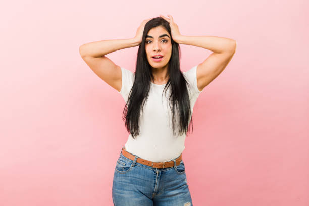 istock Excited latin woman looking surprised while screaming 2002997595