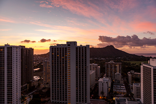 sunset in waikiki, diamond head crater silhouette, colored sky on oahu island, hawaii islands, usa.