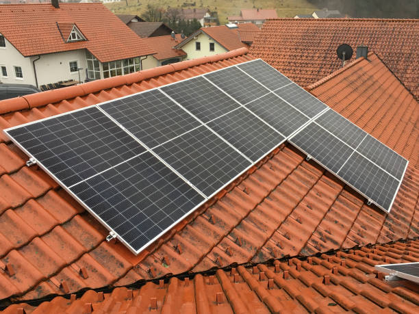 istock Solar panels on a tiled roof in rainy weather 2003014195