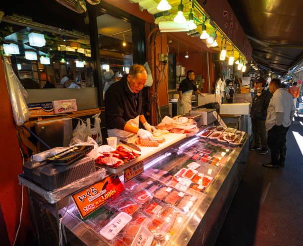 Tokyio, Japan. January 9, 2024. preparing food at stalls at the Tsukiji Outer Market in the city centre
