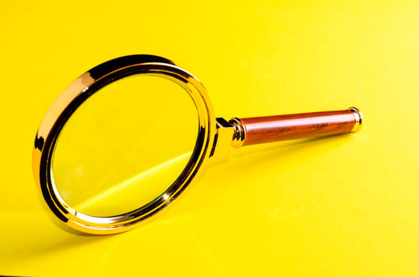 Vintage Magnify Glass Loupe on a Colored Background