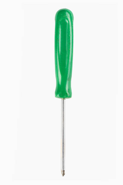 Green flat head screwdriver isolated on white background. Work tool. File contains clipping path.