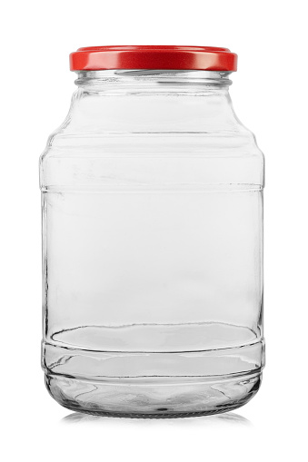 Empty glass jar with a screw cap for food and canned food. Isolated on white background. File contains clipping path.