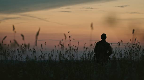 istock Unrecognizable soldier going to war in morning 2003111408
