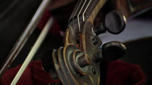 An Old Violin in a Violin Repair Shop. Close Up.