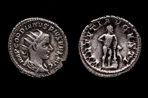 Roman coin,  Gordian III. AR Antoninianus, 241-243 ,Ancient roman coin with portrait of emperor isolated on black
