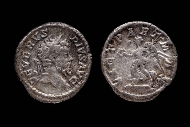 istock Roman coin, AR Denarius,Septimius Severus, Rome mint,  193 - 211 AD., Ancient roman coin with portrait of emperor isolated on black 2003175199