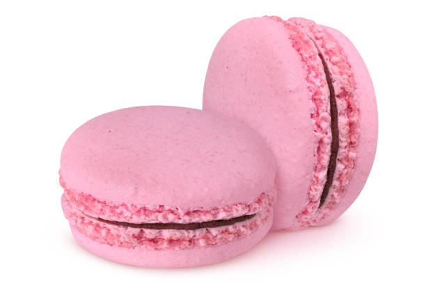 istock Pink macarons with chocolate filling on isolated white background 2003175219