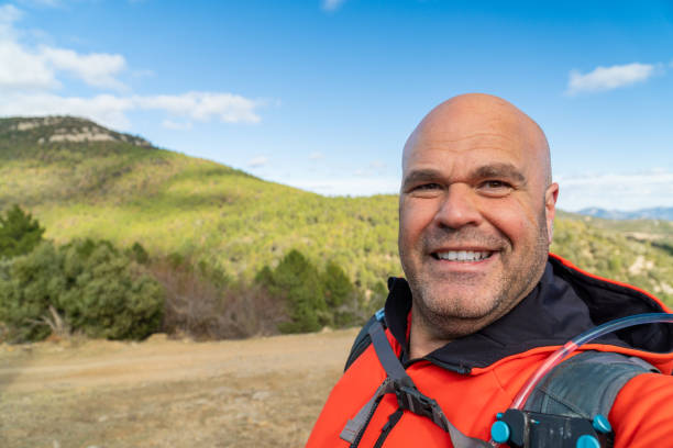istock Hiker takes a selfie walking on the mountains. 2003183218