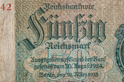 Vintage elements of old paper banknotes.Bonistics.50 reichsmark bill of Germany 1933.Banknote Kaiser's Germany.Fragment  banknote for design purpose.