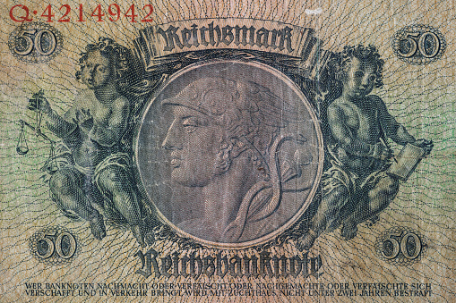 Vintage elements of old paper banknotes.Bonistics.50 reichsmark bill of Germany 1933.Banknote Kaiser's Germany.Fragment  banknote for design purpose.