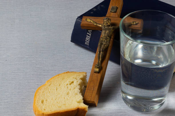 Lent - bread, crucifix, water and holy bible