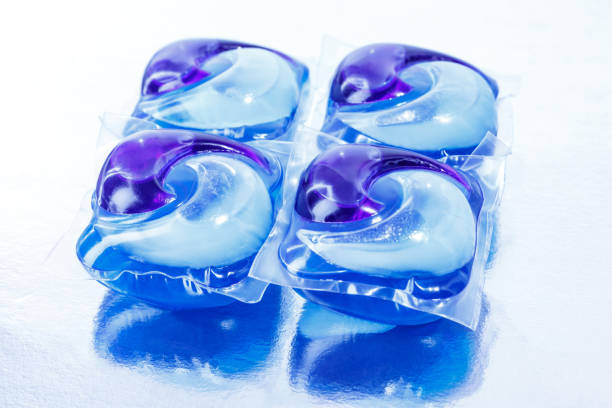 Capsules with detergent for washing machine on white background.Washing gel pods.Dishwasher capsules.Washing and clean things.Housework concept.