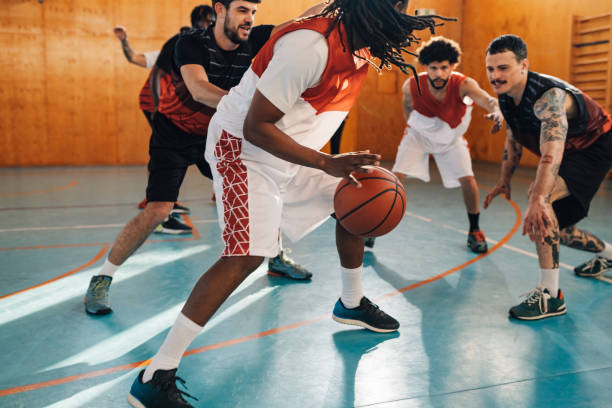 istock Interracial professional basketball players in action. 2003237806