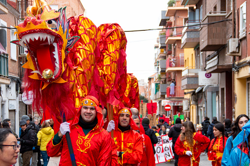 Chinese New Year Wooden Dragon Parade. In this case we can see the dance with dragons through the city