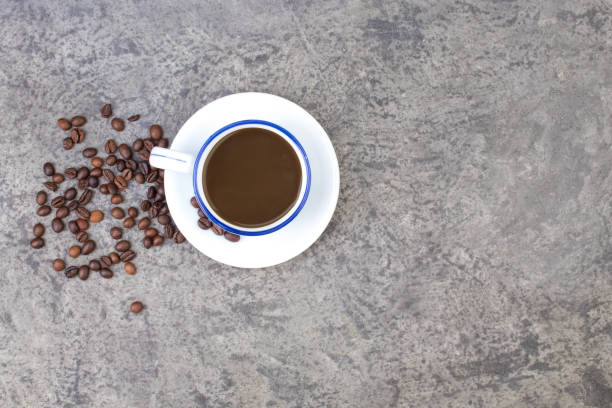 istock Cup of coffee, coffee beans on a concrete background. top view. 2003254167