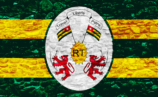 Flag and coat of arms of Togolese Republic on a textured background. Concept collage.