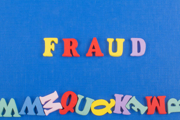 istock FRAUD word on blue background composed from colorful abc alphabet block wooden letters, copy space for ad text. Learning english concept. 2003262187