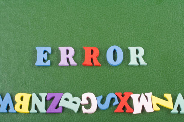 istock ERROR word on green background composed from colorful abc alphabet block wooden letters, copy space for ad text. Learning english concept. 2003266966