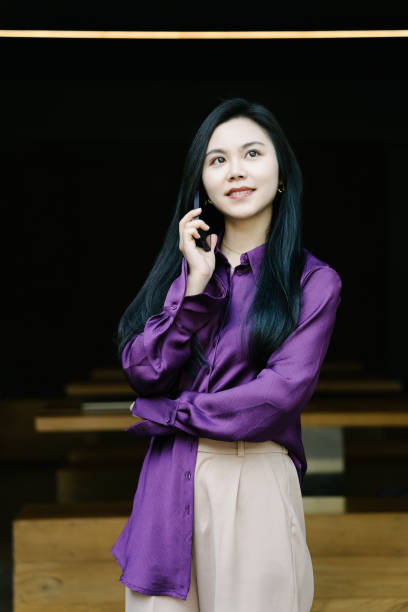 istock Asian young businesswomen using Mobile phone in a coffee shop 2003283733