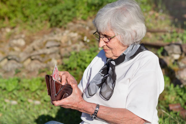 istock Senior Woman holding  wallet 2003303717