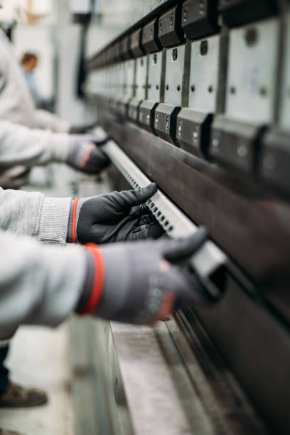 istock The technician operator working with press brake hydraulic bending machine. stock photo 2003305312