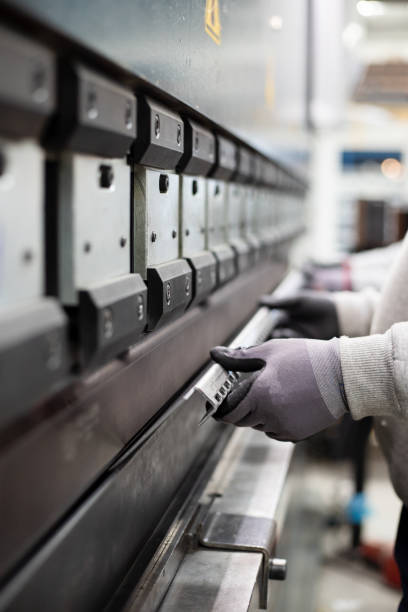 istock The technician operator working with press brake hydraulic bending machine. stock photo 2003307012