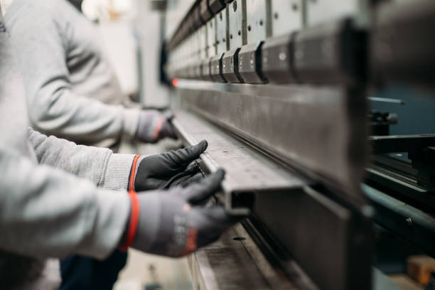 istock The technician operator working with press brake hydraulic bending machine. stock photo 2003307953