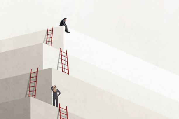 istock Woman Looking Up At Man Who Has Reached The Top 2003320637