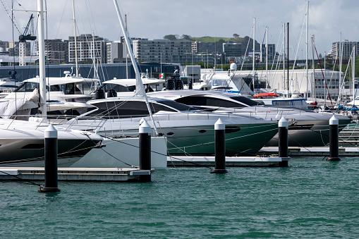 Melbourne, Australia – April 29, 2023: A luxury yacht at Melbourne harbor with city skyline reflection