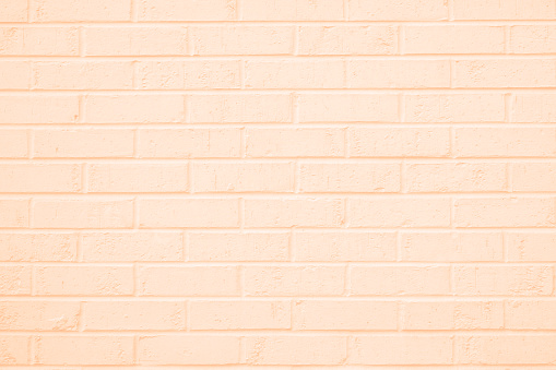 Brick wall painted a peach color