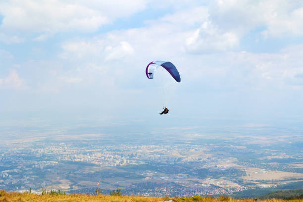 Paraglider sail on a blue sky