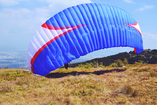 Paraglider over mountains