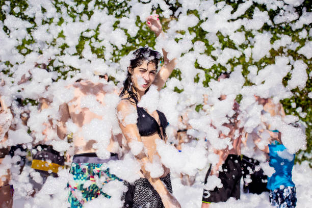 Smiling Woman having fun on a foam summer party