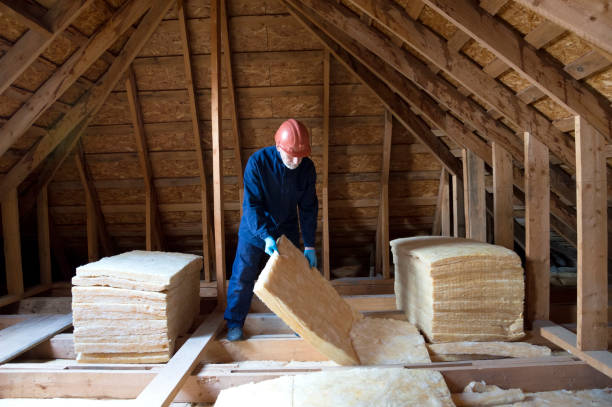 istock Roof insulation. A worker puts glass wool insulation in the attic. 2003400238