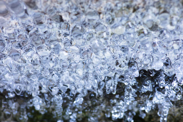A close-up of ice formations in a fountain, in the mountains.
