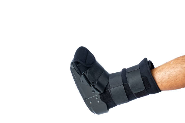 istock man's leg with an orthopedic boot for foot breaks or ankle sprains on white background 2003550605