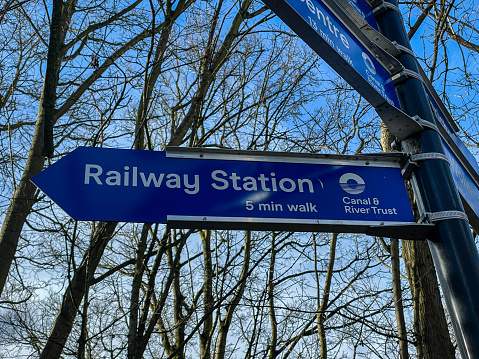 oxford, uk, 11 Feb 2024, railway station blue sign board next to canal in oxford