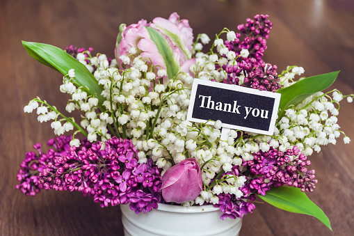 Thank you  Card with Lily of the Valley Flowers Bouquet  on  Wooden Background